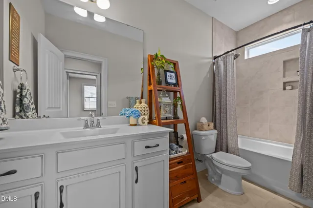 a view of hallway with stairs and wooden floor