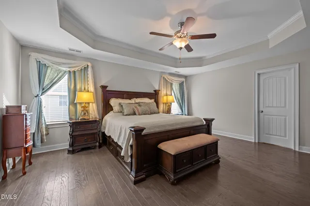 a white bath tub sitting next to a shower