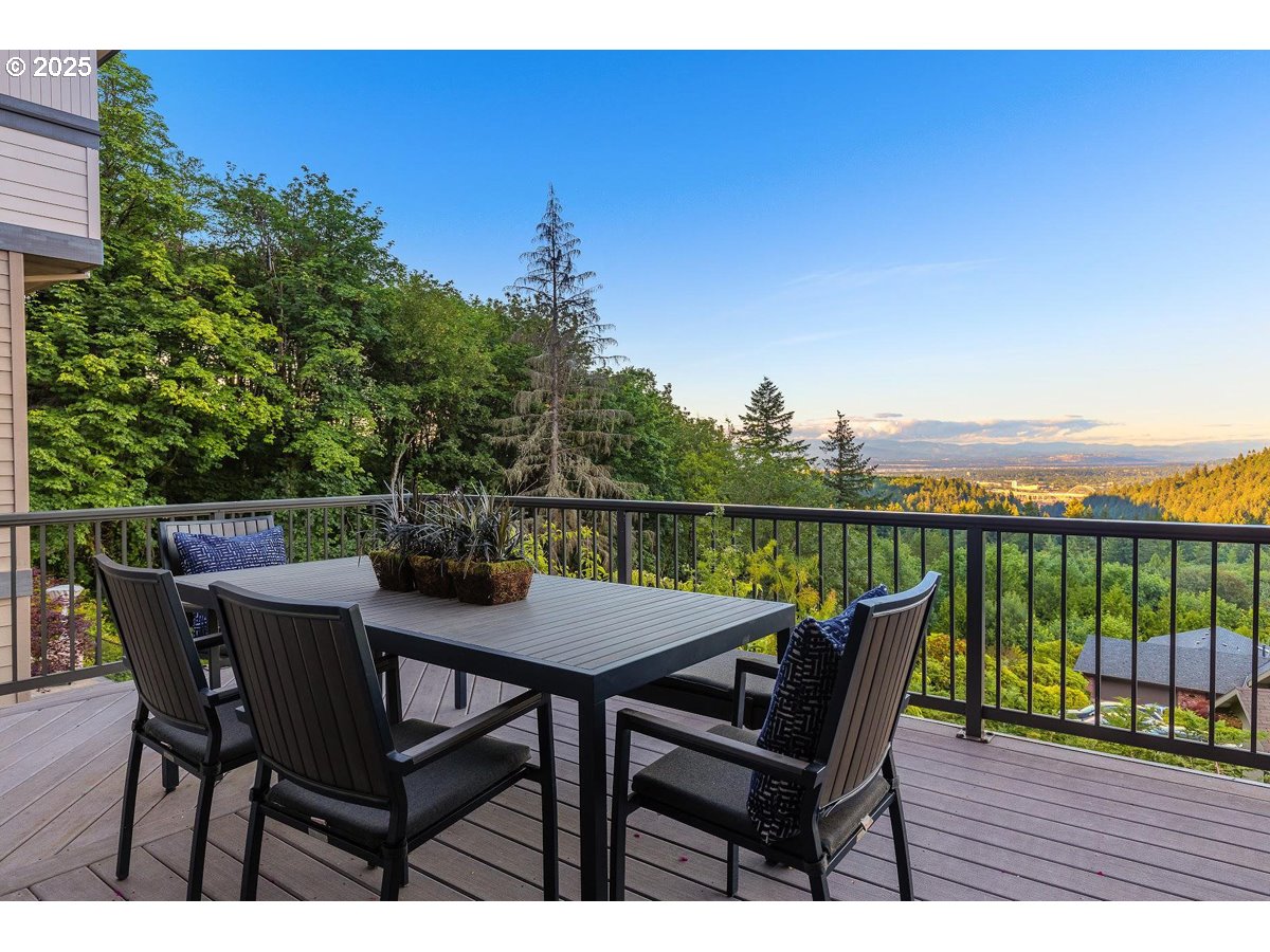 6631 Northwest Meridian Ridge Drive Portland, OR 97210 - Photo 36 of 37 a view of a roof deck with table and chairs
