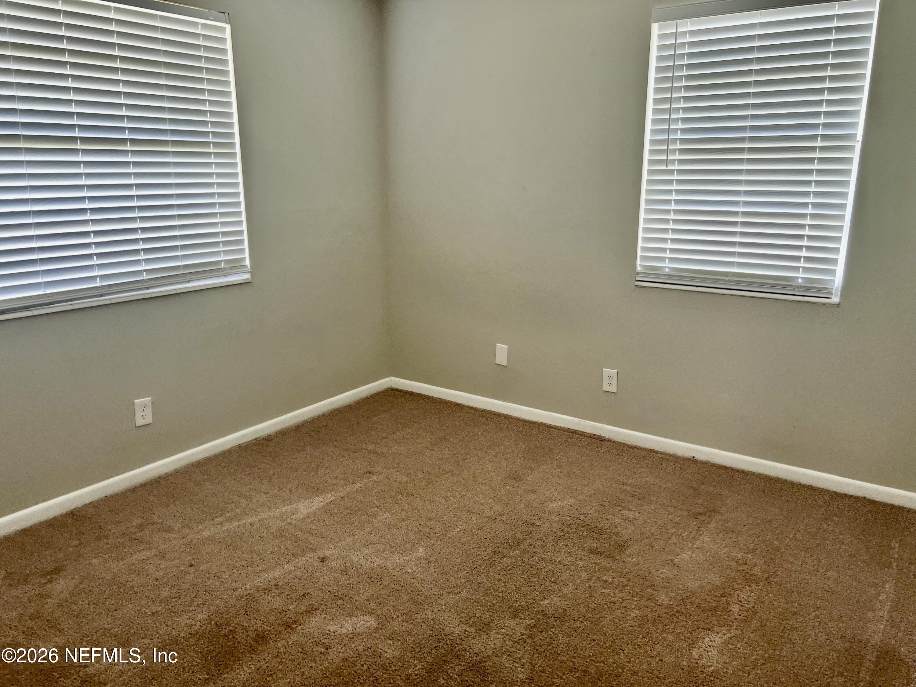 10964 Bacall Road West Jacksonville, FL 32218 - Photo 12 of 19 an empty room with a window
