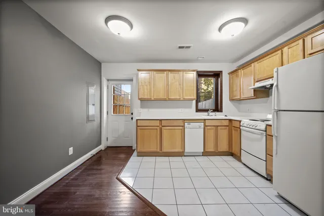 a view of hallway with wooden floor