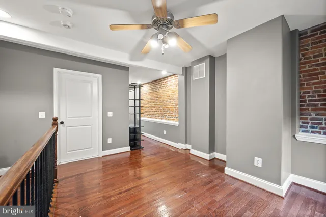 a view of an entryway with wooden floor