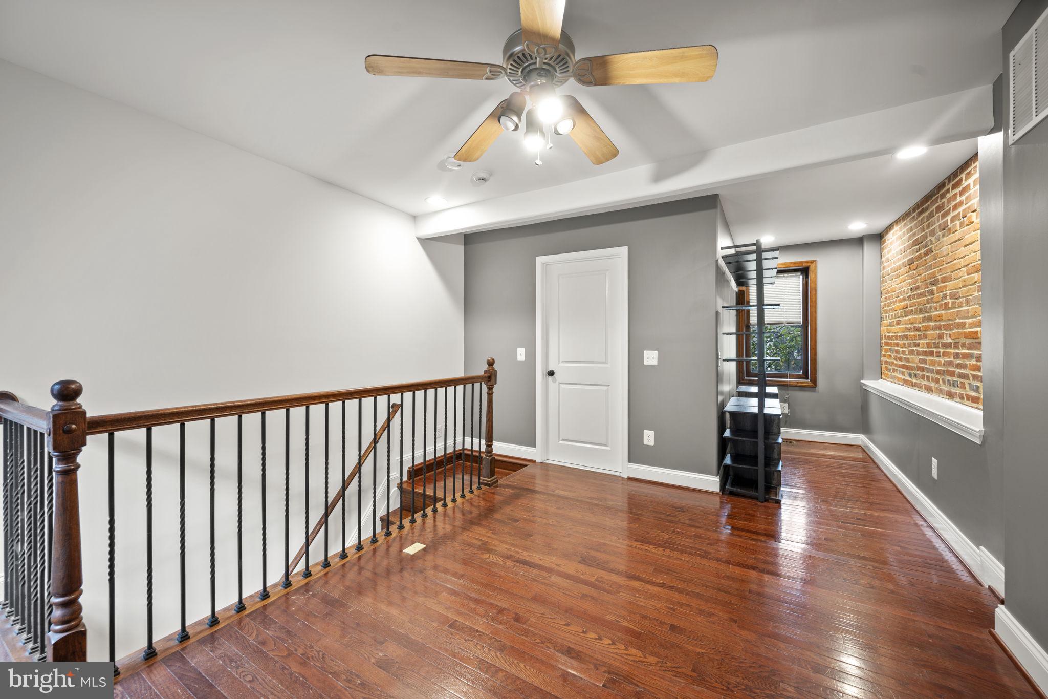 413 Griffin Court Baltimore, MD 21231 - Photo 24 of 37 a view of an entryway with wooden floor