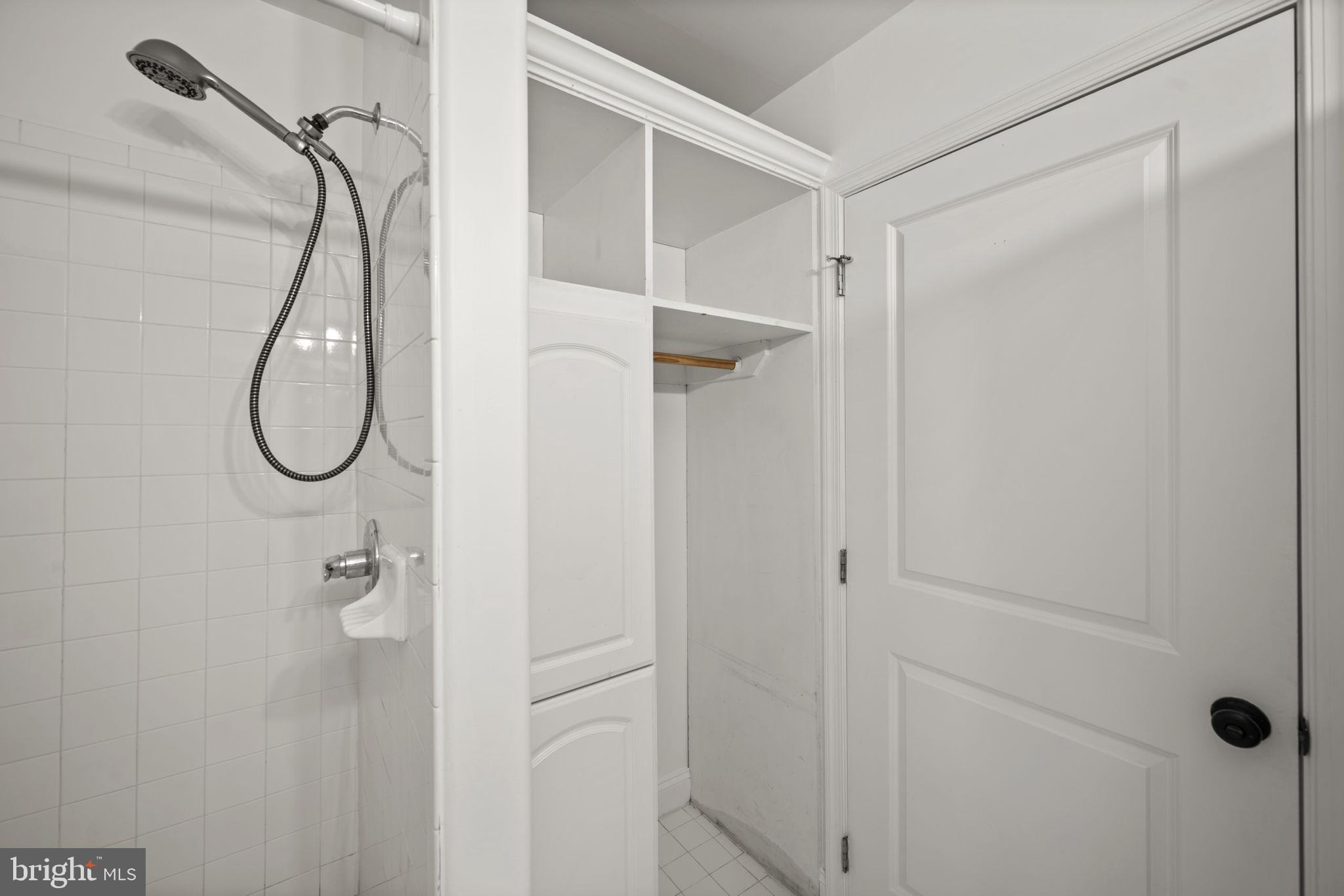 413 Griffin Court Baltimore, MD 21231 - Photo 29 of 37 a bathroom with a glass shower door