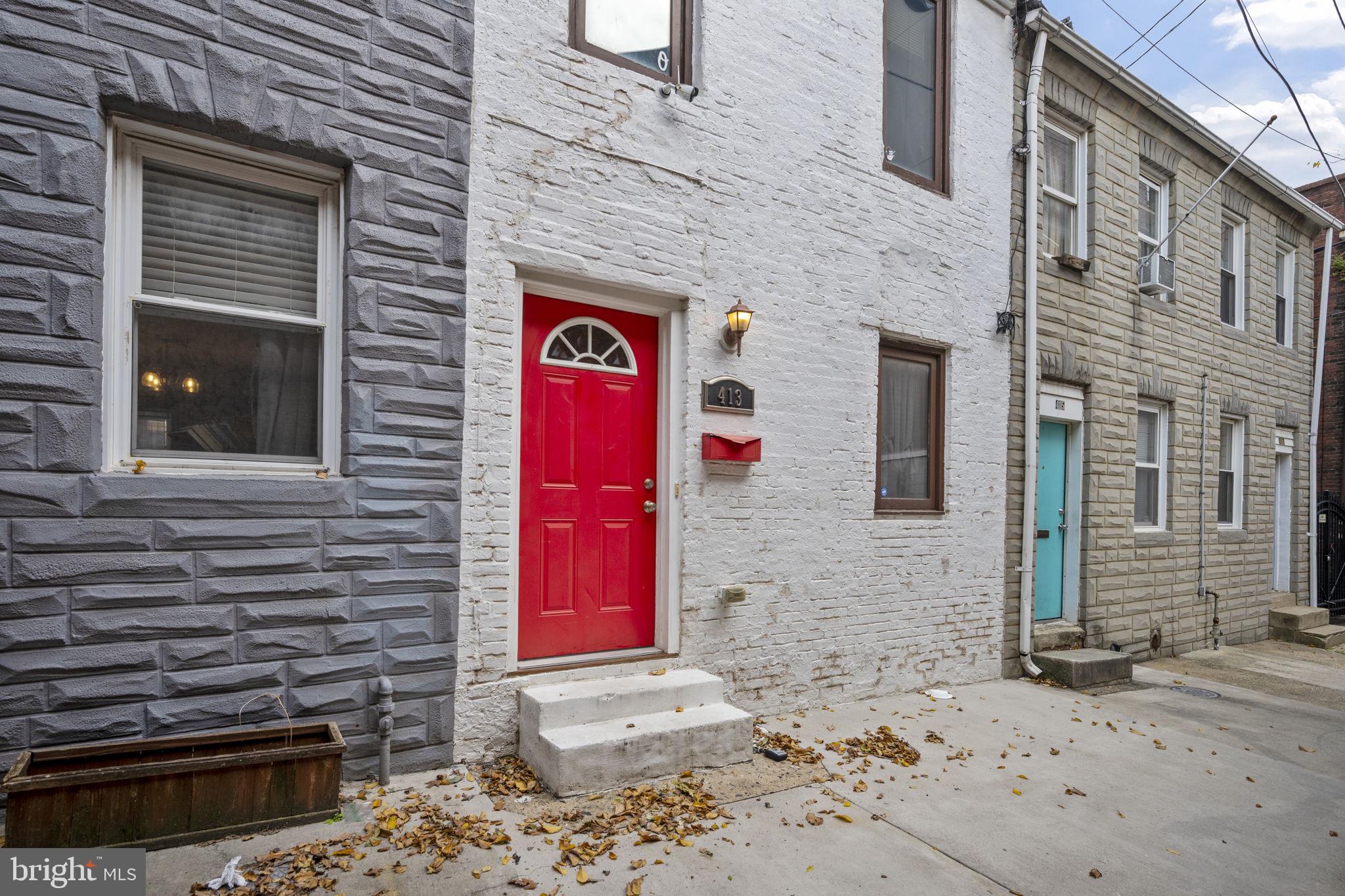 413 Griffin Court Baltimore, MD 21231 - Photo 3 of 37 a front view of a building with a brick wall