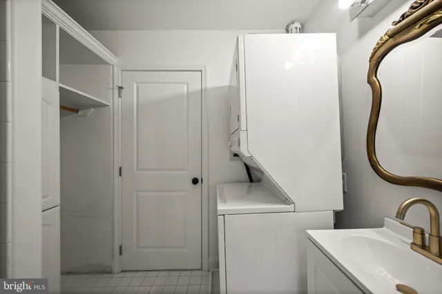 a bathroom with a toilet a sink and a mirror