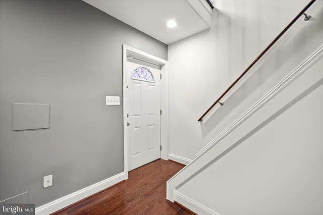 a view of entryway with wooden floor