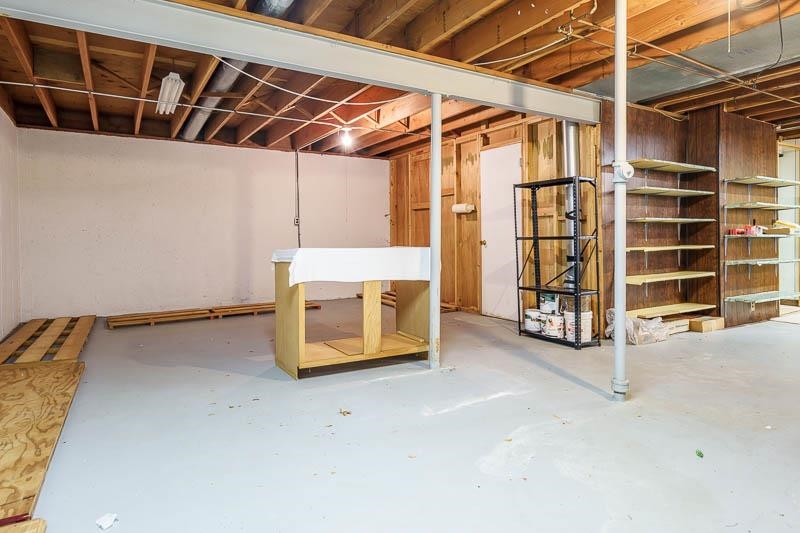 1110 Roxbury Close Rockford, IL 61107 - Photo 30 of 36 a view of an empty room with wooden floor and windows
