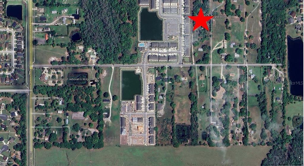 Freedom Road Kissimmee, FL 34746 - Photo 2 of 5 a bird view of building and yard
