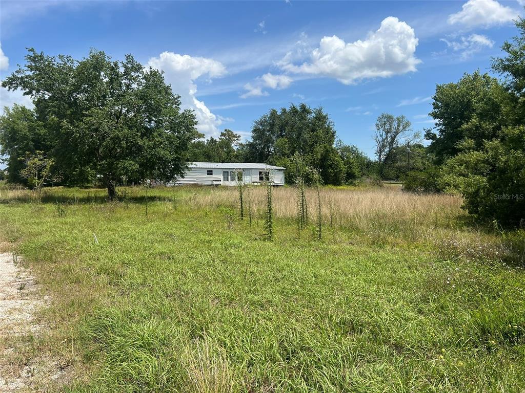 Freedom Road Kissimmee, FL 34746 - Photo 4 of 5 a view of a lake with houses in the back