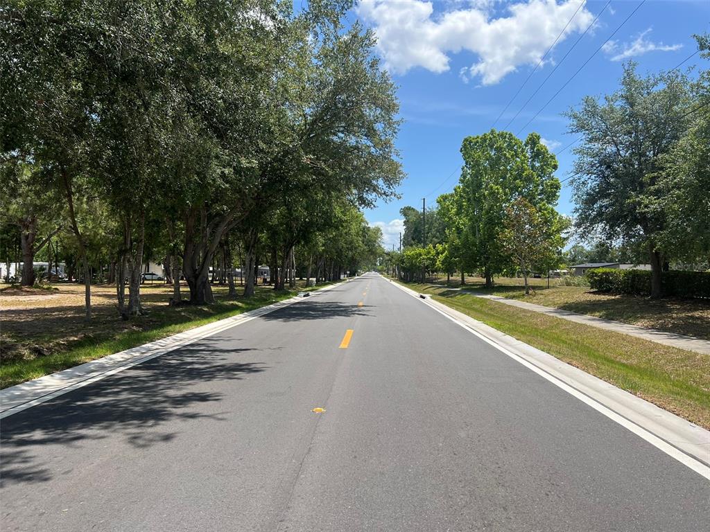 Freedom Road Kissimmee, FL 34746 - Photo 5 of 5 a view of street with large trees