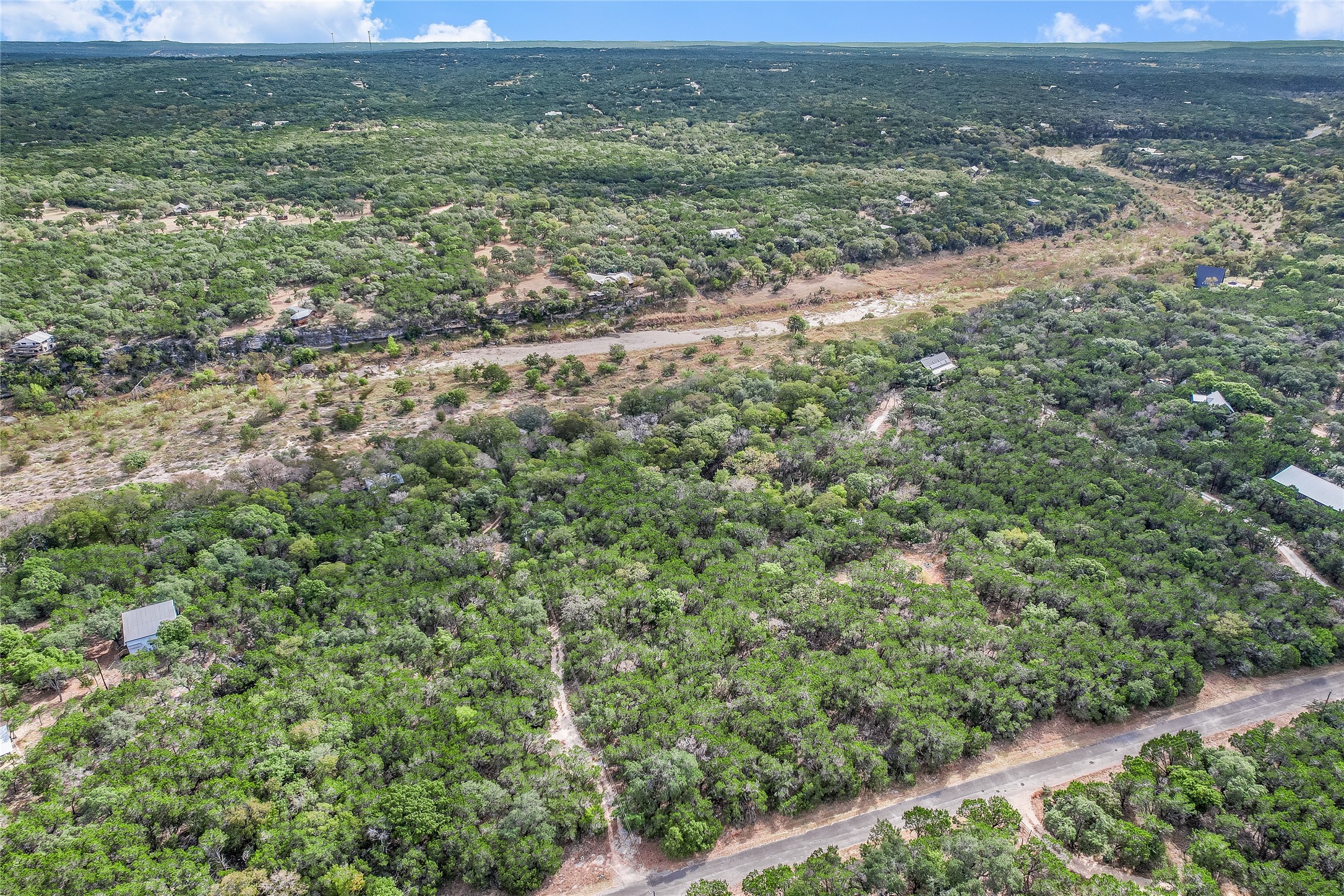 401 Days End Road Wimberley, TX 78676 - Photo 2 of 16 a view of a field with an outdoor space