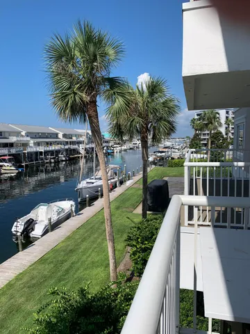 a view of a house with pool and ocean view