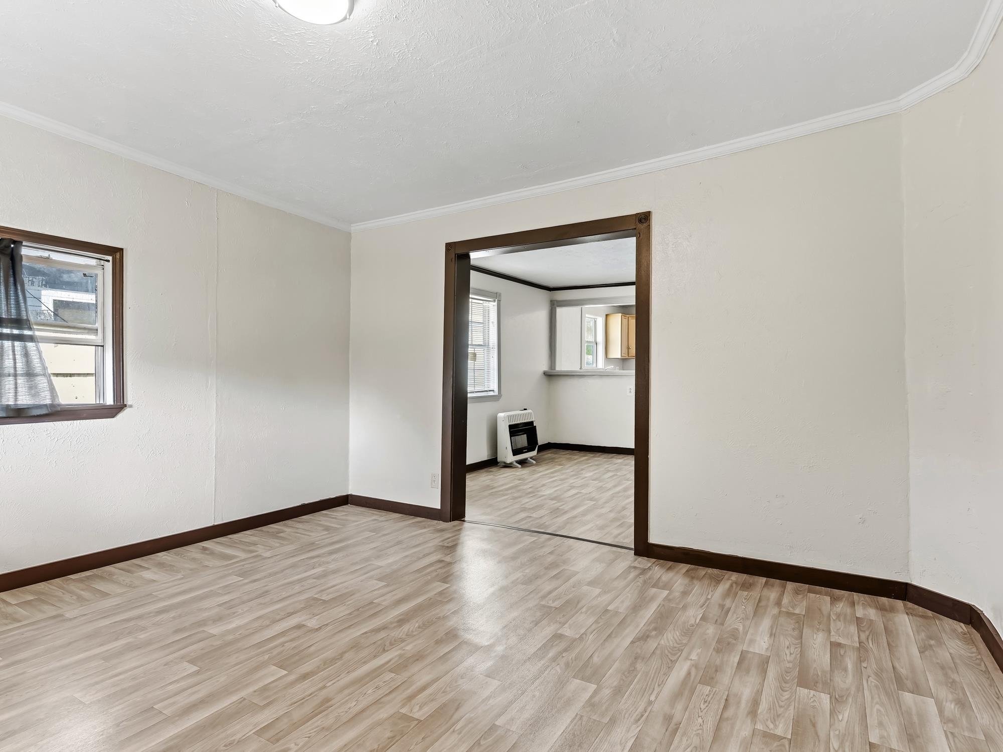737 9th Street Port Arthur, TX 77640 - Photo 4 of 20 a view of an empty room and wooden floor