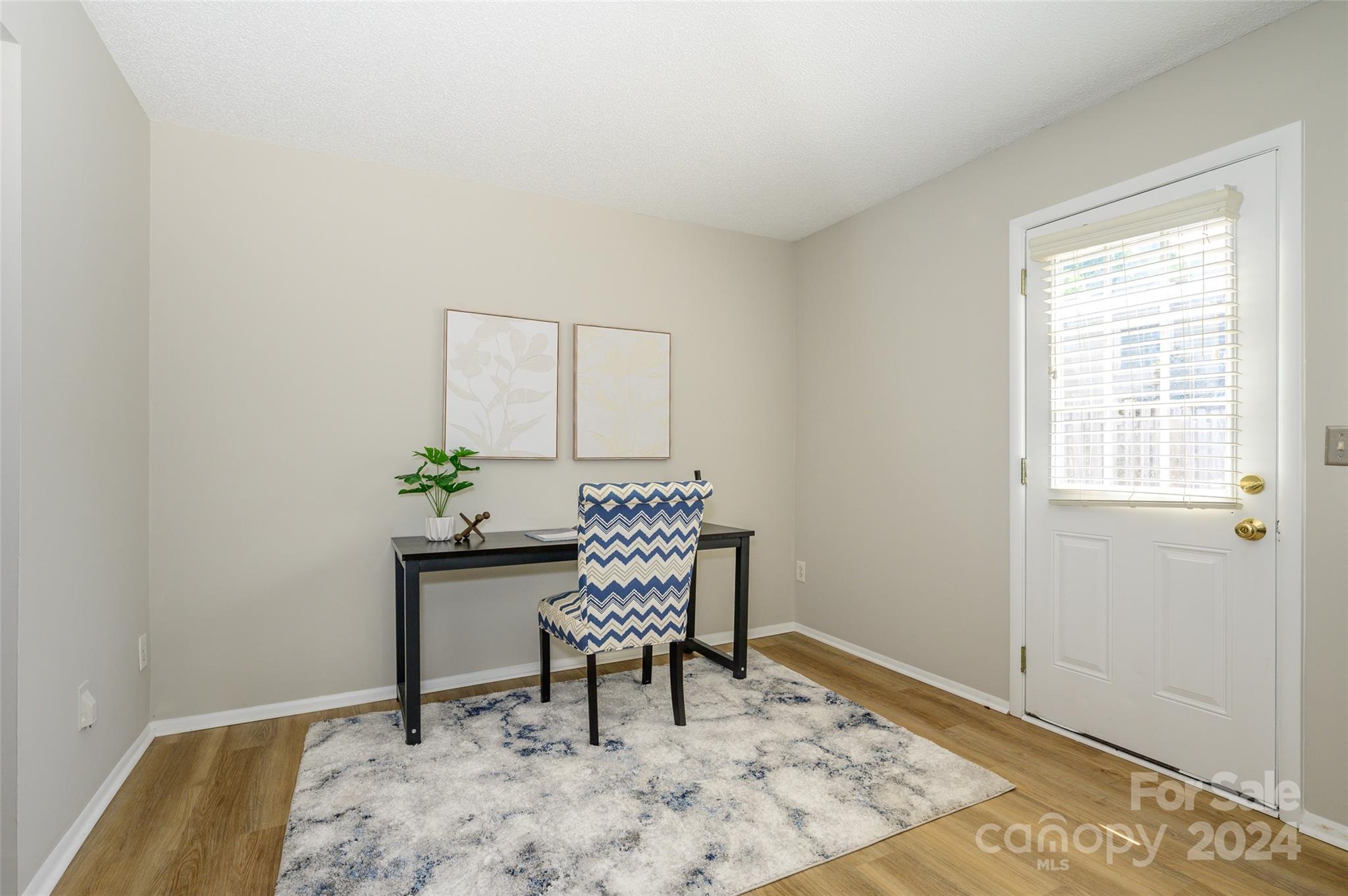 1211 Scaleybark Road, Unit B Charlotte, NC 28209 - Photo 16 of 30 a chair and table in a room