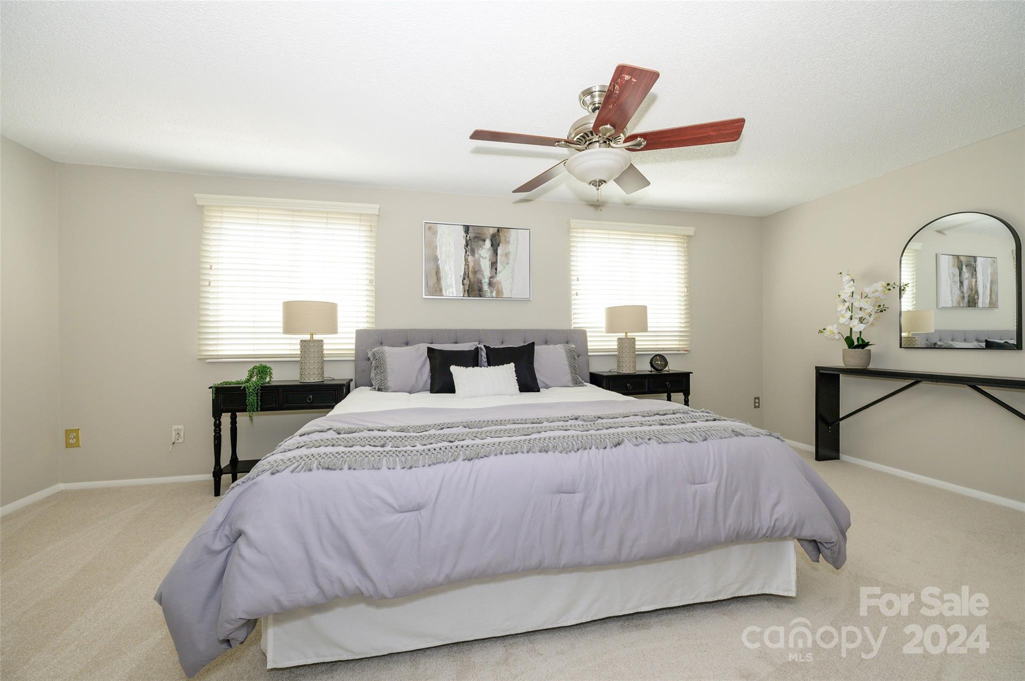 1211 Scaleybark Road, Unit B Charlotte, NC 28209 - Photo 19 of 30 a bedroom with a bed and a chandelier