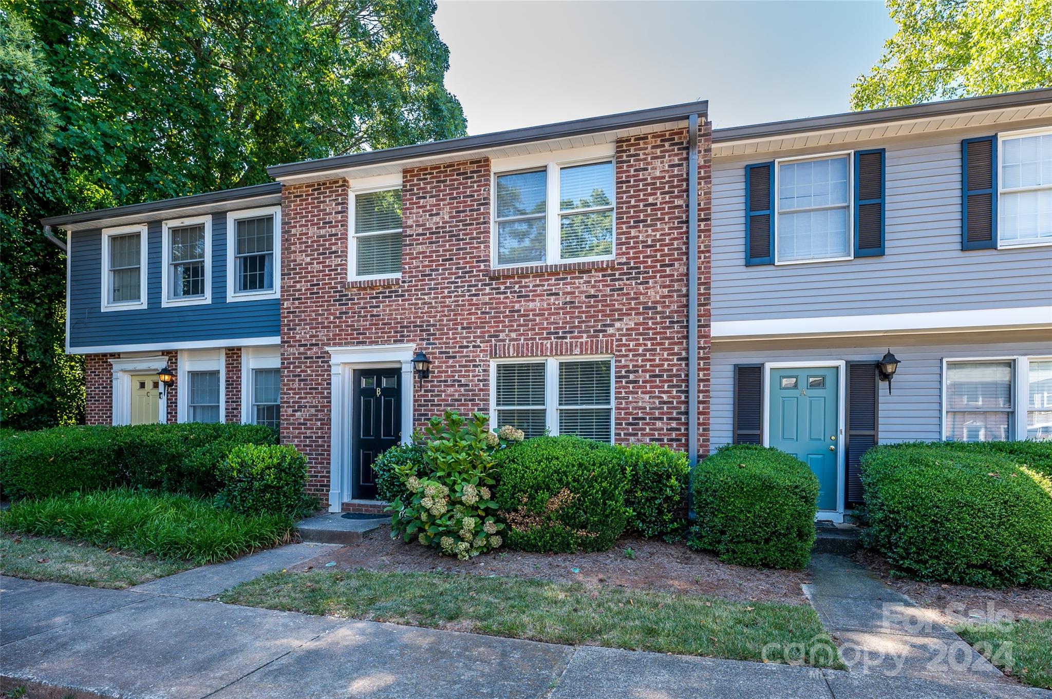 1211 Scaleybark Road, Unit B Charlotte, NC 28209 - Photo 2 of 30 a front view of a house with garden