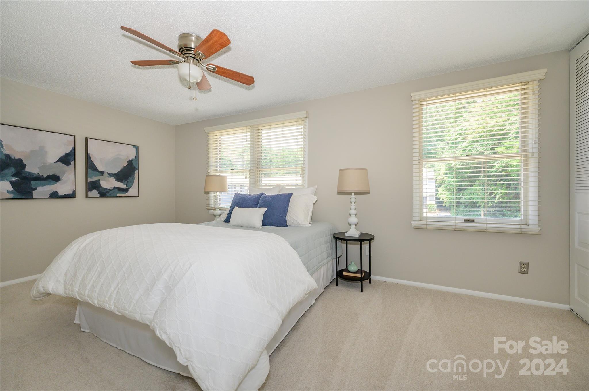 1211 Scaleybark Road, Unit B Charlotte, NC 28209 - Photo 23 of 30 a bedroom with a bed and a large window
