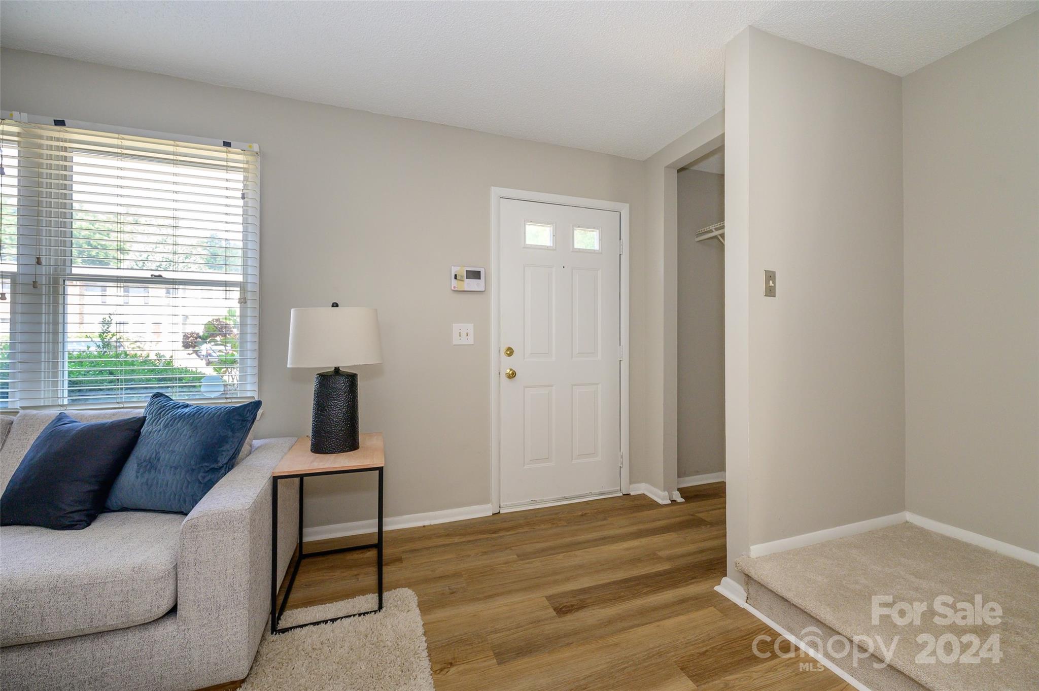 1211 Scaleybark Road, Unit B Charlotte, NC 28209 - Photo 5 of 30 a living room with furniture and a window