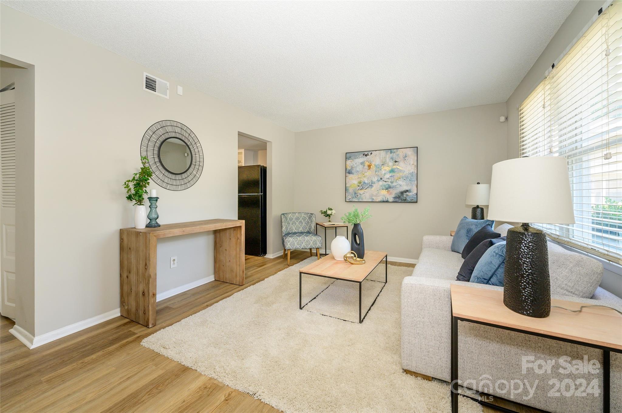 1211 Scaleybark Road, Unit B Charlotte, NC 28209 - Photo 6 of 30 a living room with furniture and a window