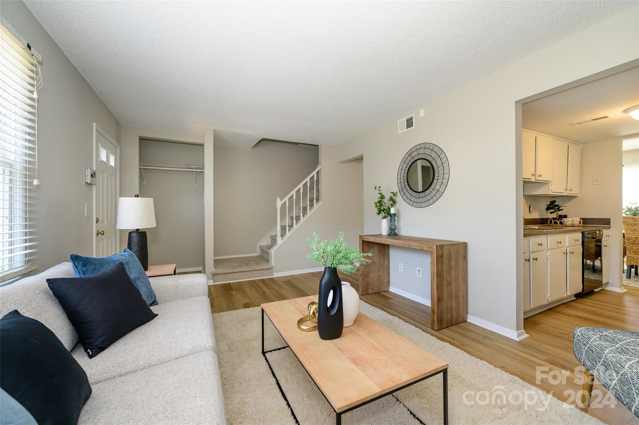 1211 Scaleybark Road, Unit B Charlotte, NC 28209 - Photo 7 of 30 a living room with furniture and wooden floor