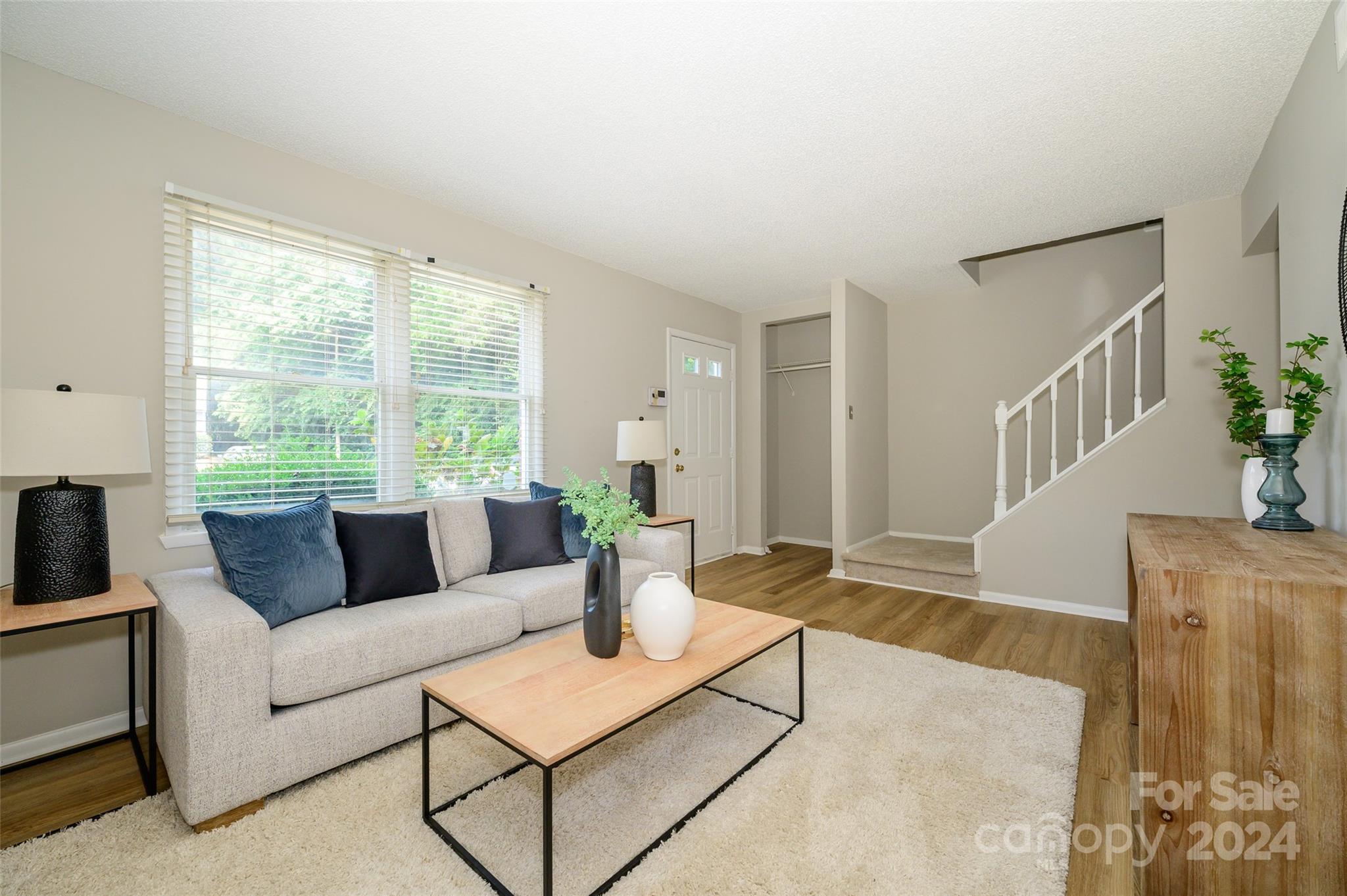 1211 Scaleybark Road, Unit B Charlotte, NC 28209 - Photo 8 of 30 a living room with furniture and a large window