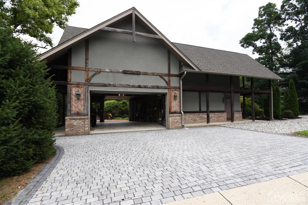 279 Cottrell Road Old Bridge, NJ 07747 - Photo 12 of 41 a front view of a house with a balcony and a garden