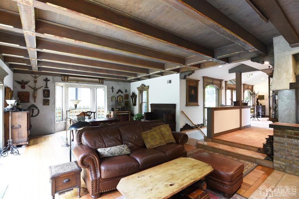 279 Cottrell Road Old Bridge, NJ 07747 - Photo 16 of 41 a living room with furniture and a fireplace