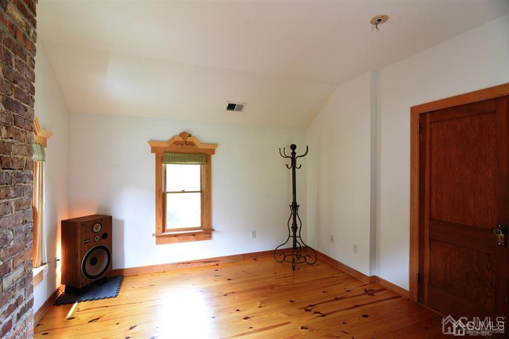 279 Cottrell Road Old Bridge, NJ 07747 - Photo 30 of 41 a view of a livingroom with a fireplace and a window