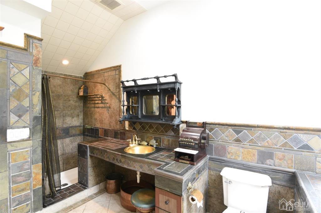 279 Cottrell Road Old Bridge, NJ 07747 - Photo 31 of 41 a bathroom with a sink a toilet and shower