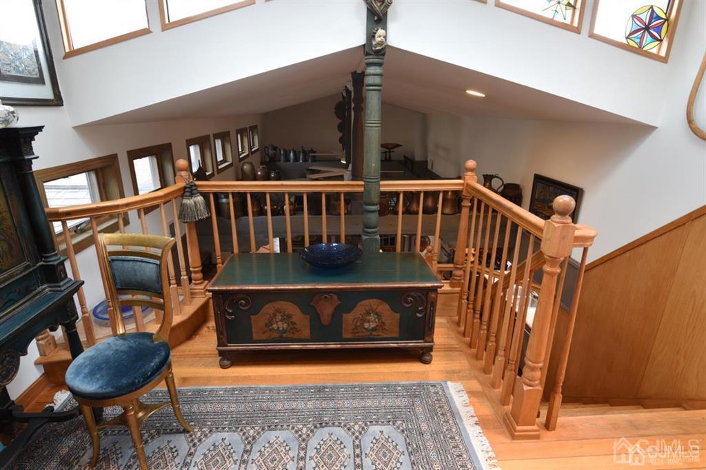 279 Cottrell Road Old Bridge, NJ 07747 - Photo 34 of 41 a view of staircase with furniture and a rug