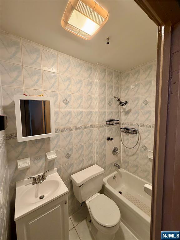 187 Main Street, Unit A Ridgefield Park, NJ 07660 - Photo 7 of 7 a bathroom with a bathtub shower sink mirror and toilet