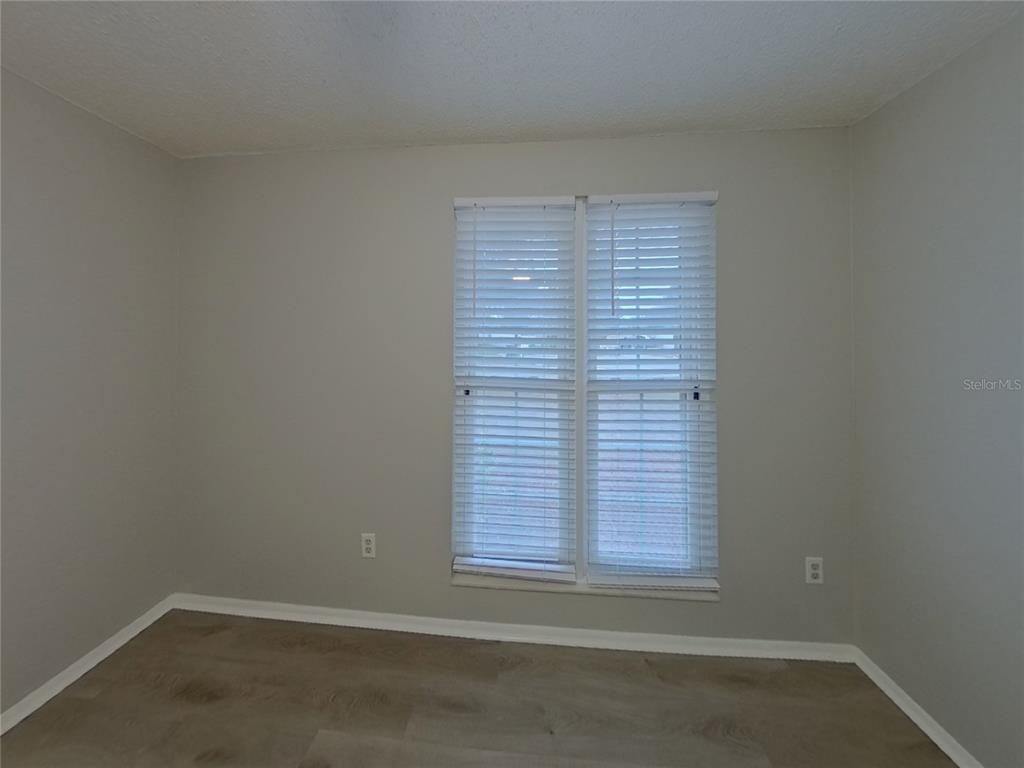 Undisclosed Address Palm Harbor, FL 34684 - Photo 12 of 15 an empty room with a window