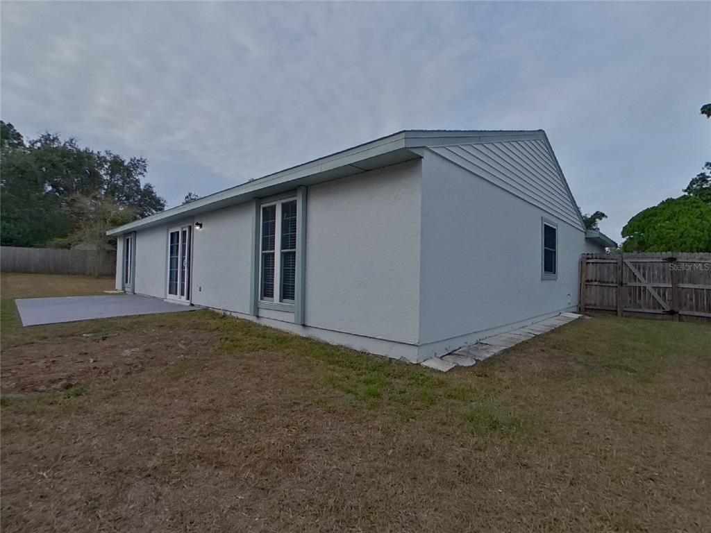 Undisclosed Address Palm Harbor, FL 34684 - Photo 14 of 15 a view of a house with backyard and garden