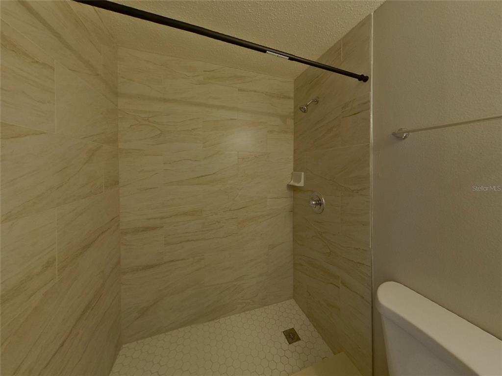 Undisclosed Address Palm Harbor, FL 34684 - Photo 9 of 15 a bathroom with a shower