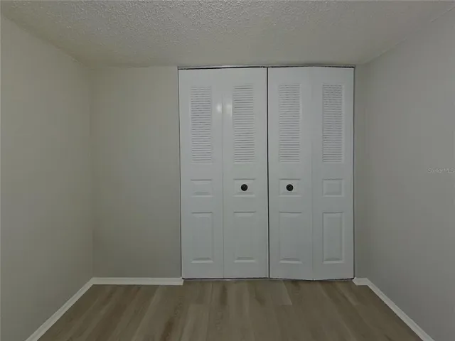 a view of room with hardwood floor