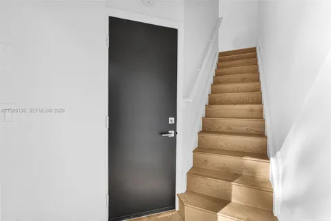 a bedroom with a bed and a television