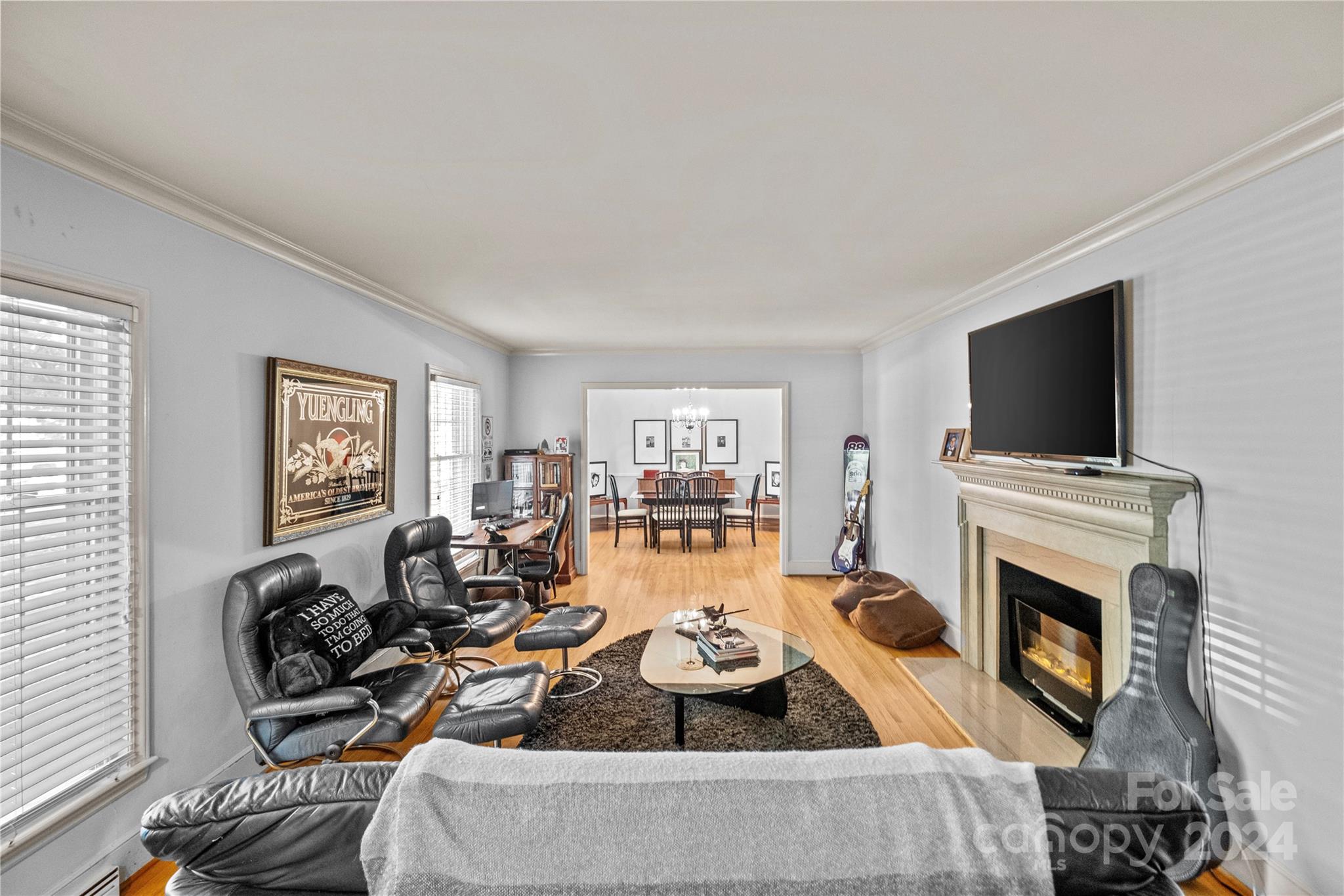 1321 Ferncliff Road Charlotte, NC 28211 - Photo 4 of 11 a living room with fireplace furniture and a flat screen tv