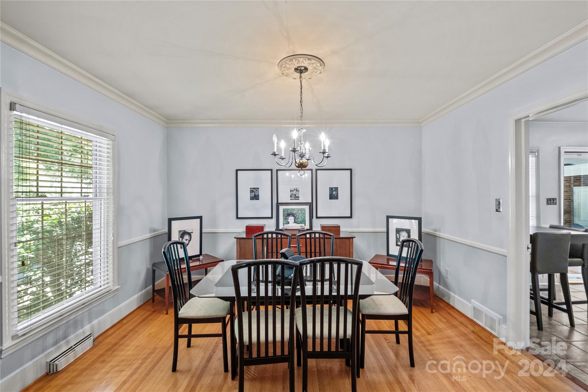 1321 Ferncliff Road Charlotte, NC 28211 - Photo 5 of 11 a view of a dining room with furniture window and wooden floor