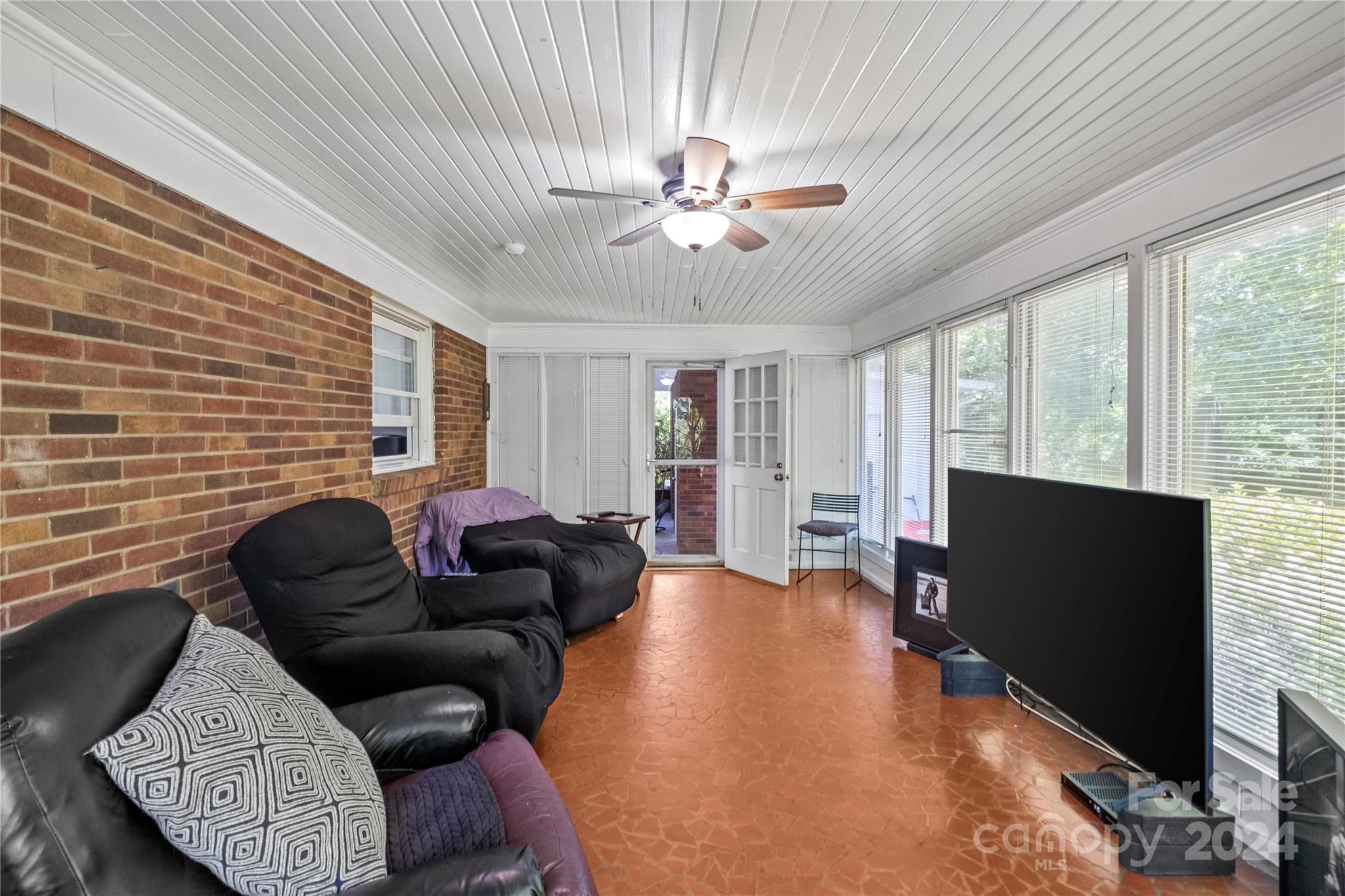 1321 Ferncliff Road Charlotte, NC 28211 - Photo 6 of 11 a living room with furniture and a flat screen tv
