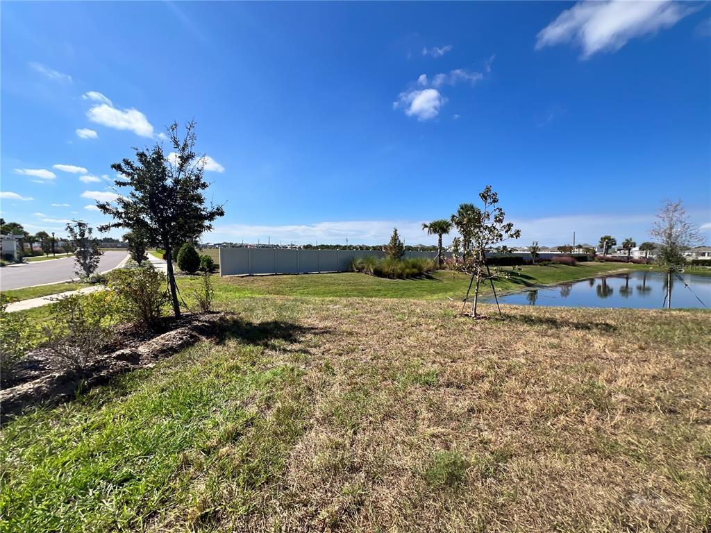 110 Mangrove Shade Circle Apollo Beach, FL 33572 - Photo 13 of 36 a view of a lake with houses in the back
