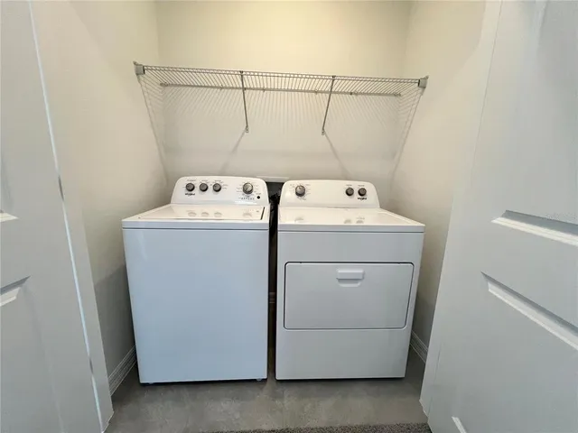 a utility room with dryer and washer