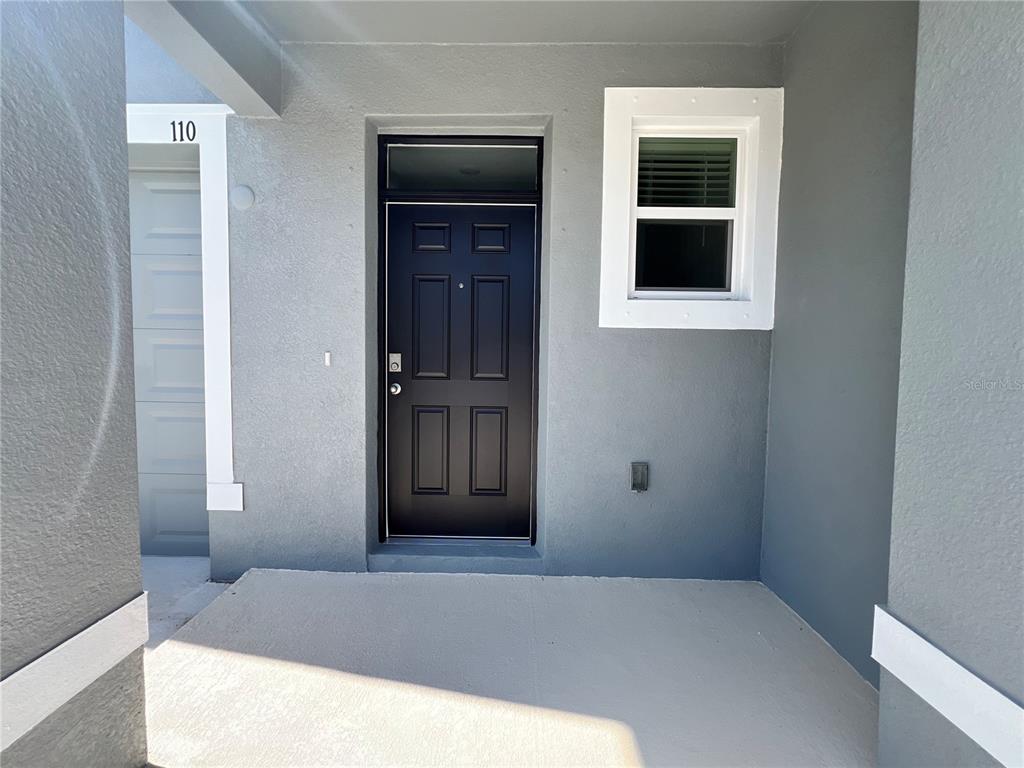 110 Mangrove Shade Circle Apollo Beach, FL 33572 - Photo 2 of 36 a bedroom with a bed and a window