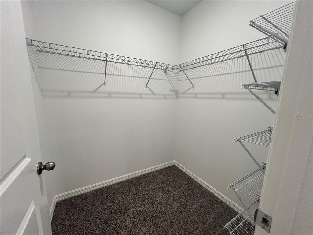 110 Mangrove Shade Circle Apollo Beach, FL 33572 - Photo 21 of 36 a view of a room with racks on the wall