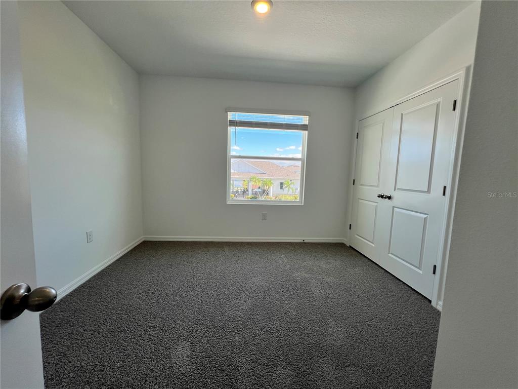110 Mangrove Shade Circle Apollo Beach, FL 33572 - Photo 24 of 36 an empty room with a window and a fireplace