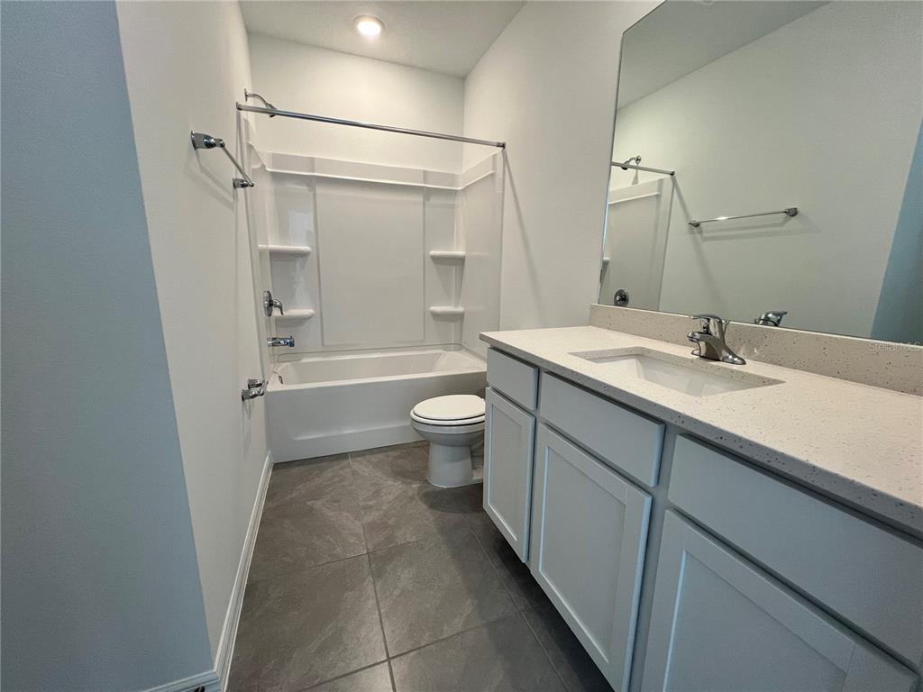 110 Mangrove Shade Circle Apollo Beach, FL 33572 - Photo 27 of 36 a bathroom with a sink a toilet and shower