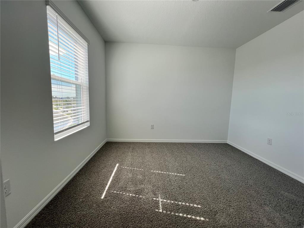 110 Mangrove Shade Circle Apollo Beach, FL 33572 - Photo 28 of 36 an empty room with a window