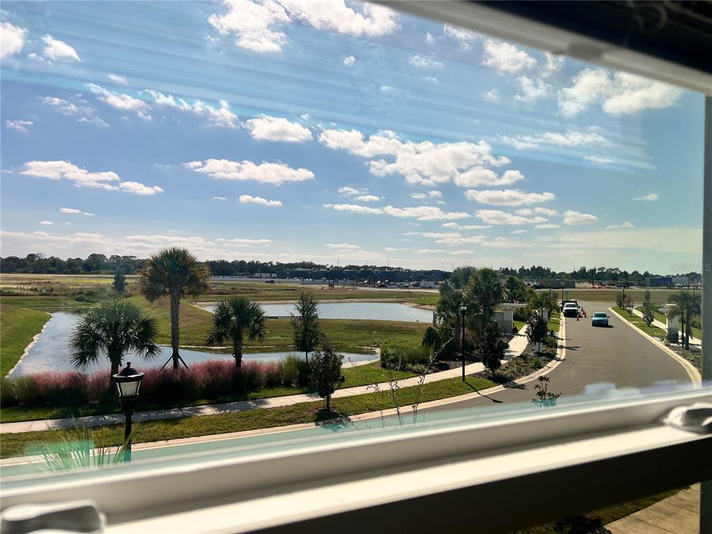 110 Mangrove Shade Circle Apollo Beach, FL 33572 - Photo 29 of 36 a view of a lake from a balcony