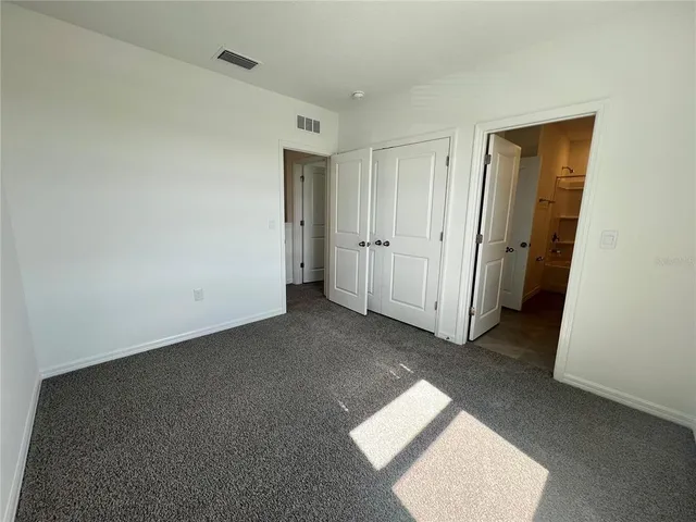 a house with palm tree in front of it