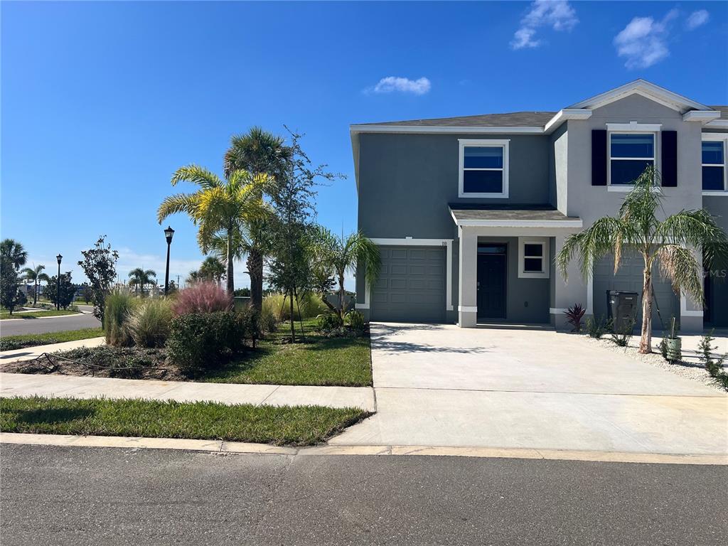 110 Mangrove Shade Circle Apollo Beach, FL 33572 - Photo 31 of 36 a house with palm tree in front of it